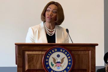 Dean Lepaine Sharpe-McHenry speaking at congressional briefing.