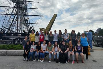 Group photo of the pirate learning community in front of the USS Constitution