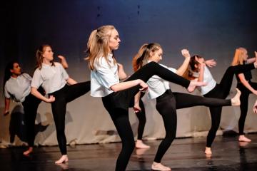 Grace Gile with the Simmons University Dance Company during a performance.