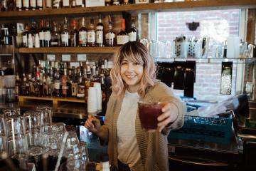 Kaitlyn Soligan Owens behind the bar.