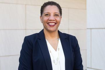 Headshot of Renique Kersh on the academic quad.