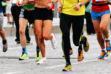 Stock Photo of lower body of runners in race