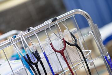 Stethoscopes hanging on rack