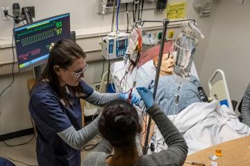 Nursing Students working on mannequin patient