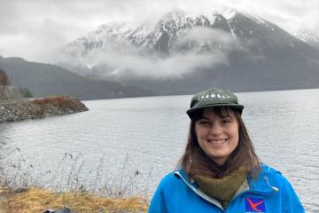 Emily Pastore Galgano with an Alaskan mountain in the background