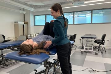 Amanda Michel ’23, ’25DPT in action in the PT lab at Simmons
