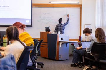Professor Naresh Agarwal teaches a course at SLIS, photograph by Ashley Purvis.