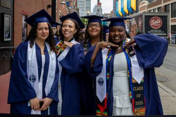 4 Simmons students lined up for Commencement