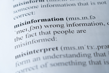 A close-up photo of a dictionary entry of the definition of misinformation