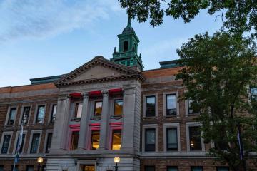 The Main Campus Building at Simmons University lit up for Juneteenth 2022