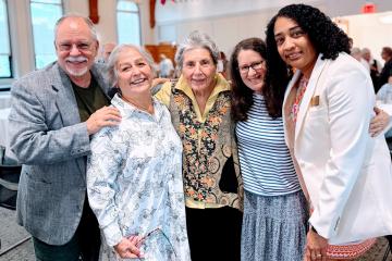 Cathryn Mercier and Ammina Kothari with attendees and speakers at the Children's Literature Summer Institute