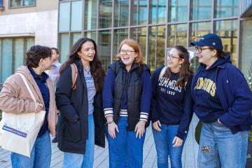 Students outside of Drinan Hall