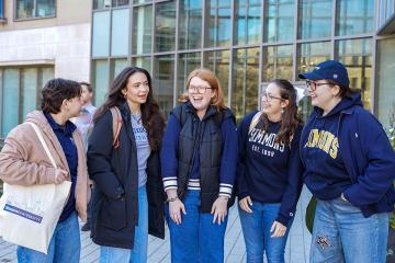 Students outside of Drinan Hall