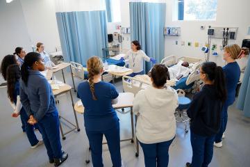 Simmons School of Nursing students and faculty in the Nursing Simulation Center, photograph by Ashley Purvis.