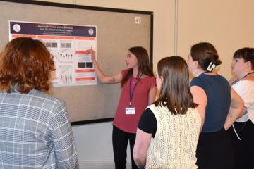 A student presenting her work at the STEM Colloquium