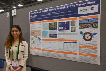 Janhavi Beley ’27 with her poster from the Society for Advancement of Chicanos/Hispanics & Native Americans in Science (SACNAS) National Diversity in STEM conference