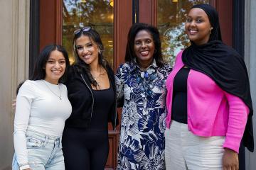 President Lynn Perry Wooten with Maureen Flores and others