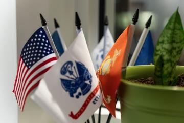 Small flags displayed in the veterans lounge. Photo by Kate Smith.