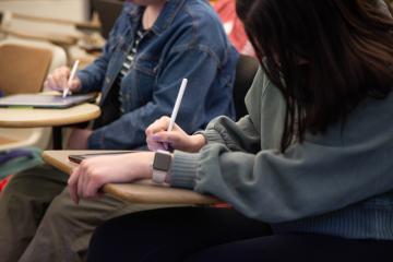 Students doing work at their desks in a Behavior Analysis class