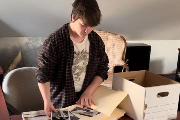 Ashten Vassar-Cain ’27MS working with some archival images