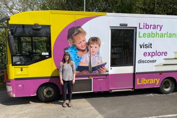 Danielle Dempsey ’24MS in front of a mobile library