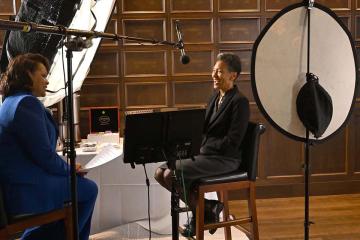Gloria  Respress-Churchwell on the LIMITLESS set with Diane Pierce William, Dr. Pierce’s daughter.
