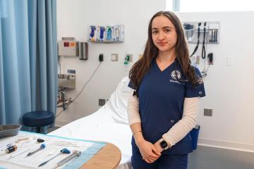 Jordan Monette ’27MSN, ’28DNP in the Nursing Simulation Lab at Simmons