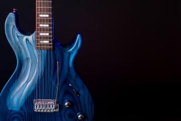 Close-up image of a colorful electric guitar