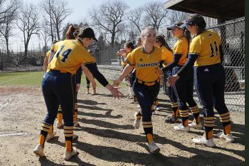 Members of the Simmons softball team celebrating a victory. Photo by M. Broglio.