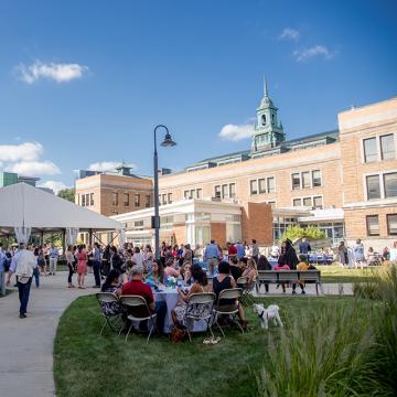Celebration following convocation on the academic campus quad.