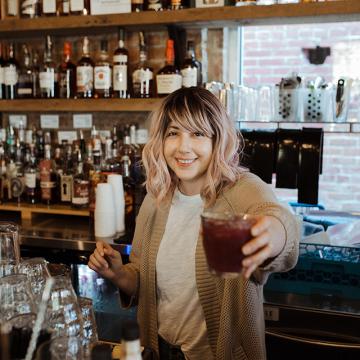 Kaitlyn Soligan Owens behind the bar.