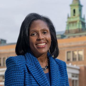 President Lynn Wooten standing in front of the MCB