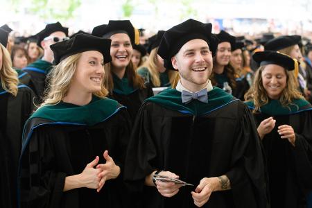 Students in their doctoral hoods