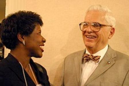 Gwen Ifill laughing with mentor and professor Alden Poole