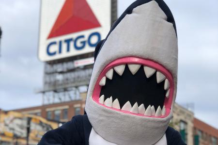 Stormy the Shark in front of the CITGO sign