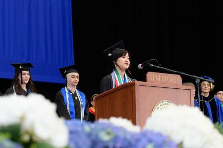 Students on stage at commencement