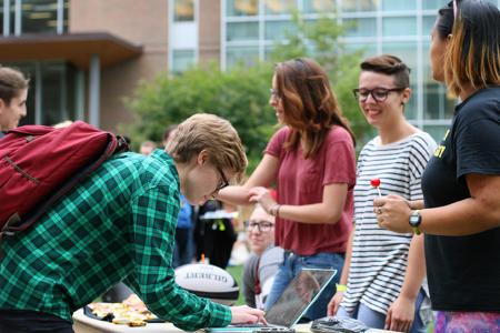 Students at an event on the residential quad
