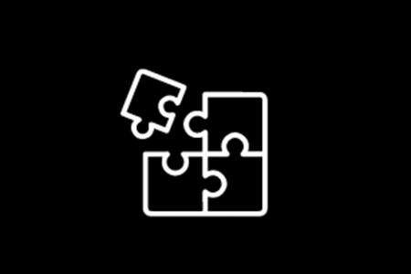 An icon of four puzzle pieces on a black background