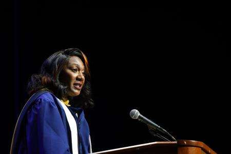 Esha S. Boyd ’25MSW speaking at the 2025 afternoon Commencement ceremony