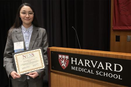 Maya McCabe '27 receives the Ruth and William Silen M.D. Award at the New England Science Symposium.