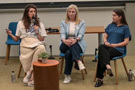 Professor of Practice Justine Pouravelis, Director of Athletics & Recreation Erica Schuling ’13MS, ’18MEd, and Simmons athlete and finance major Lauren Krupnikoff ’27 lead a panel about sports management