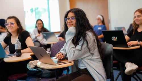 A group of Simmons behavior analysis students in a classroom