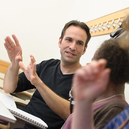 Graduate student talking in class