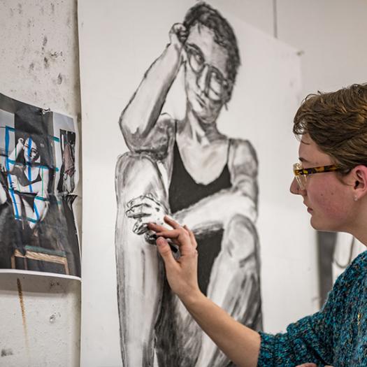 A student works on their self portrait