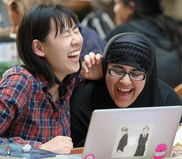 Students sitting together and laughing