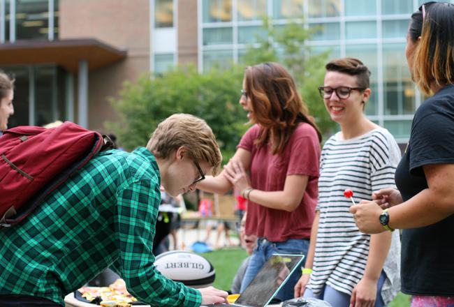 Students signing up for activities on the residential quad