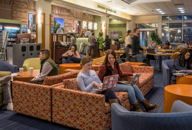 Students sitting in a common area in the Main College Building at Simmons University