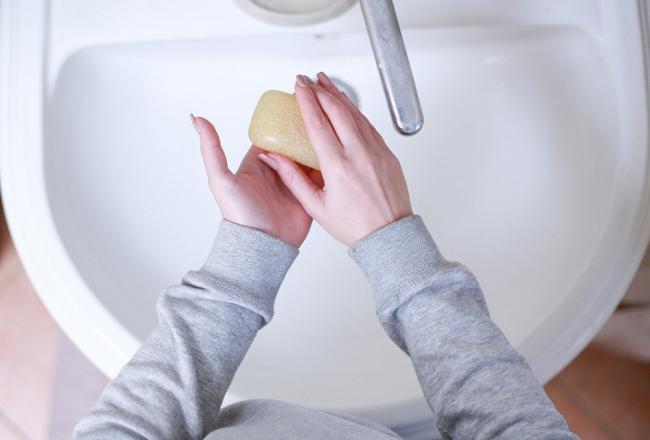 A person washing their hands