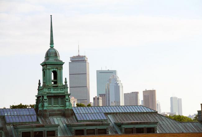 Simmons University Main College Building's cupola with the Boston city skyline in the background