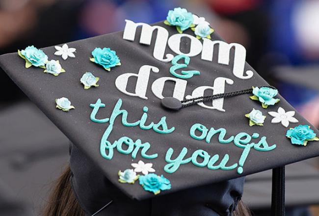 Graduation cap that reads "Mom and Dad, this one is for you"
